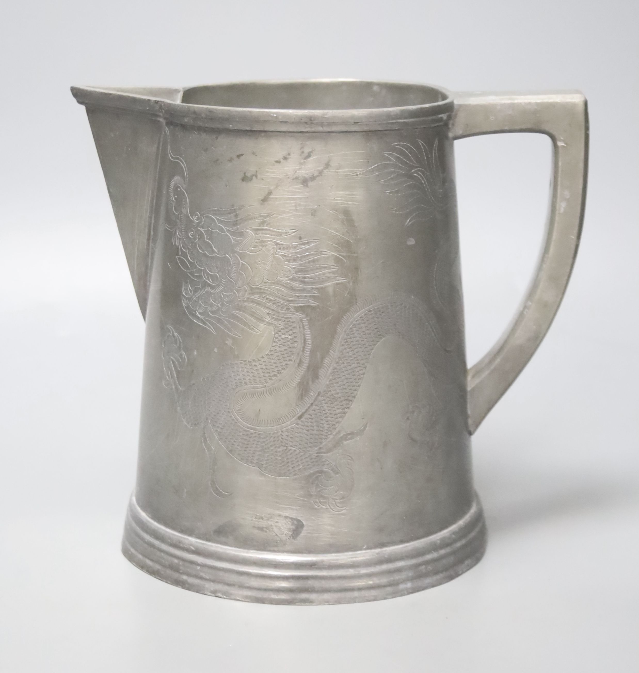 A late 19th century Chinese dragon pewter jug, 18cm high